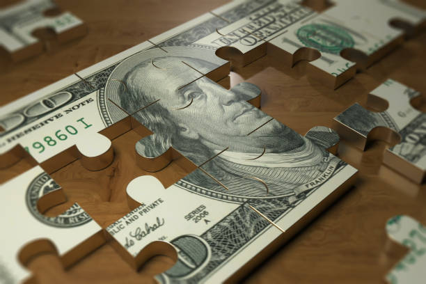 dollar-puzzle-piece-on-the-wood-table-finance-and-business-industry